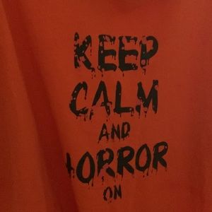 Xl unisex shirt.  Says “Keep Calm and Horror On”